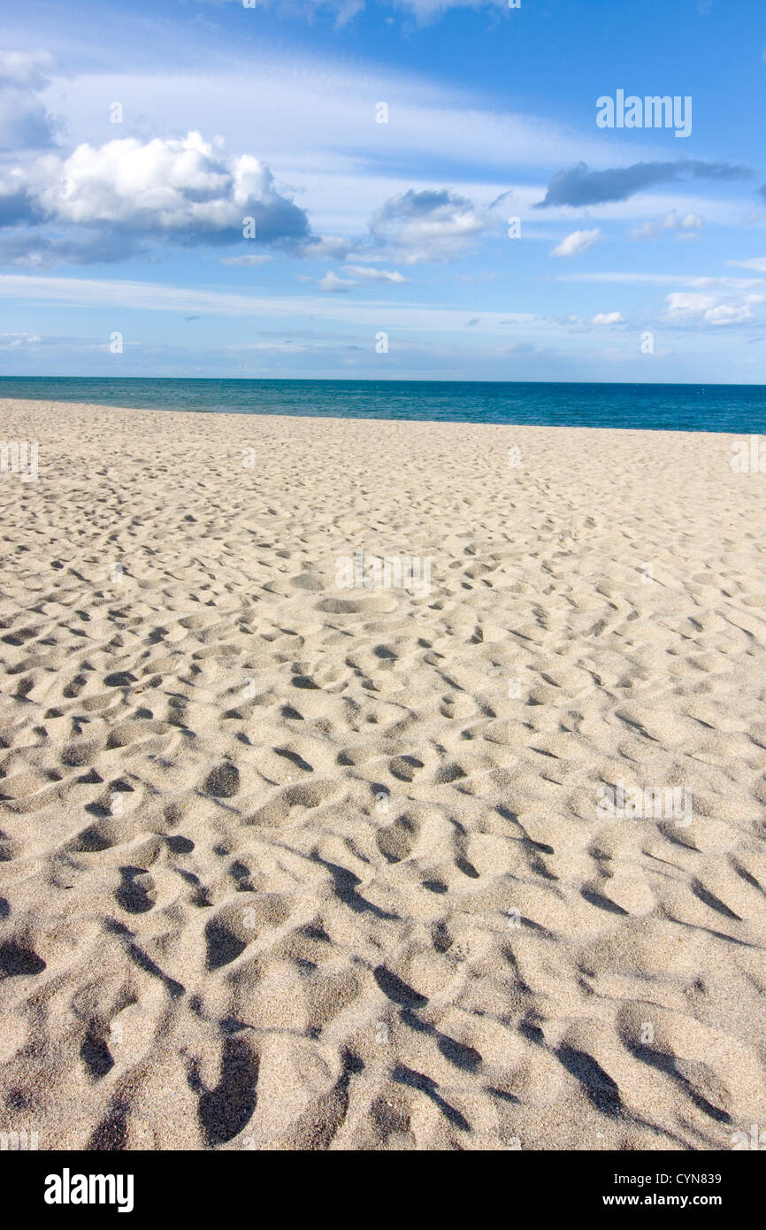 Cloudy sky above a sandy beach - Focus on the beach Stock Photo - Alamy