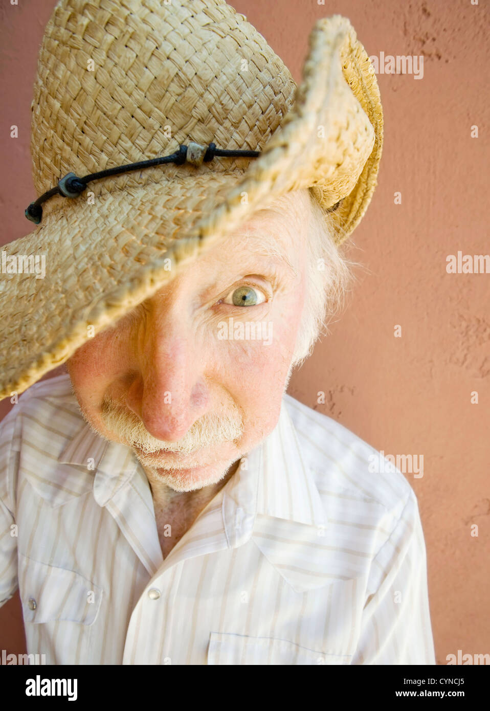 Senior Citizen Man with a Funny Expression Wearing a Straw Cowboy Hat Stock  Photo - Alamy