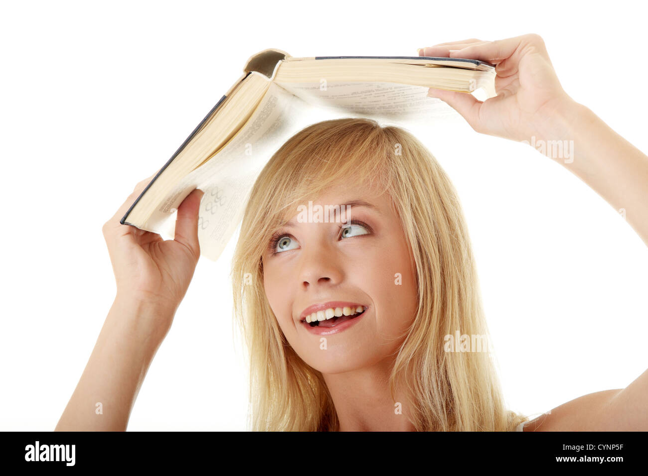 Teen girl with book over her head, isolated on white Stock Photo - Alamy