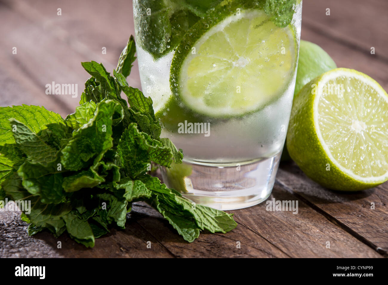 Fresh made Mojito on wooden background Stock Photo