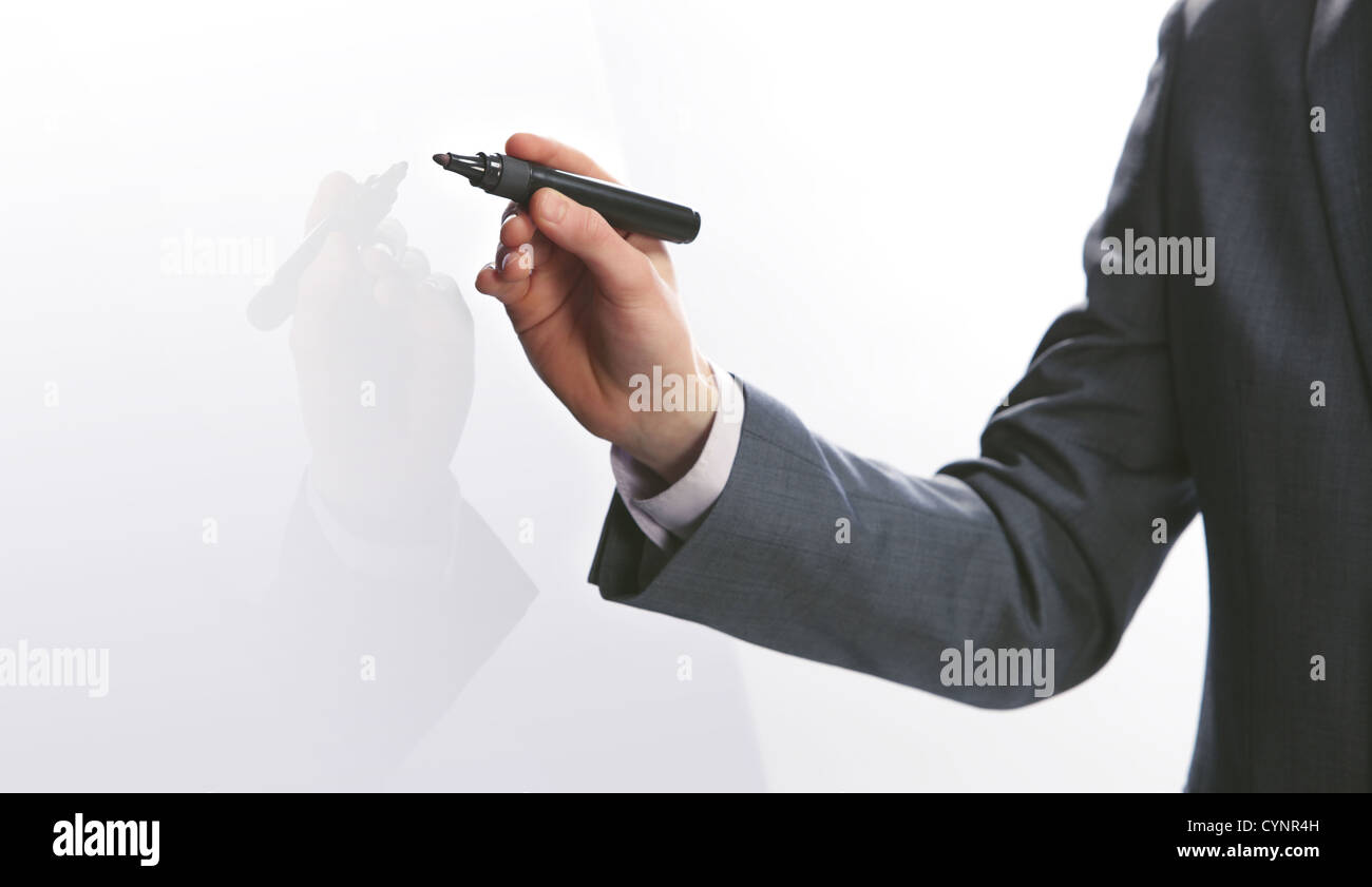 Businessman hand drawing in a whiteboard, copy space Stock Photo - Alamy