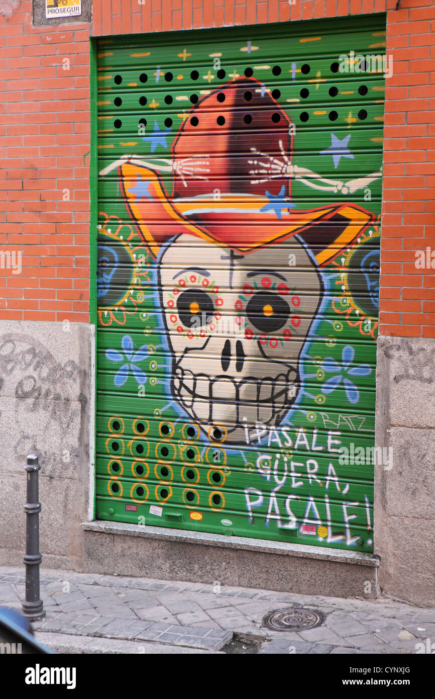 Day of the Dead skull painting on shop shutter, Madrid, Spain. Stock Photo