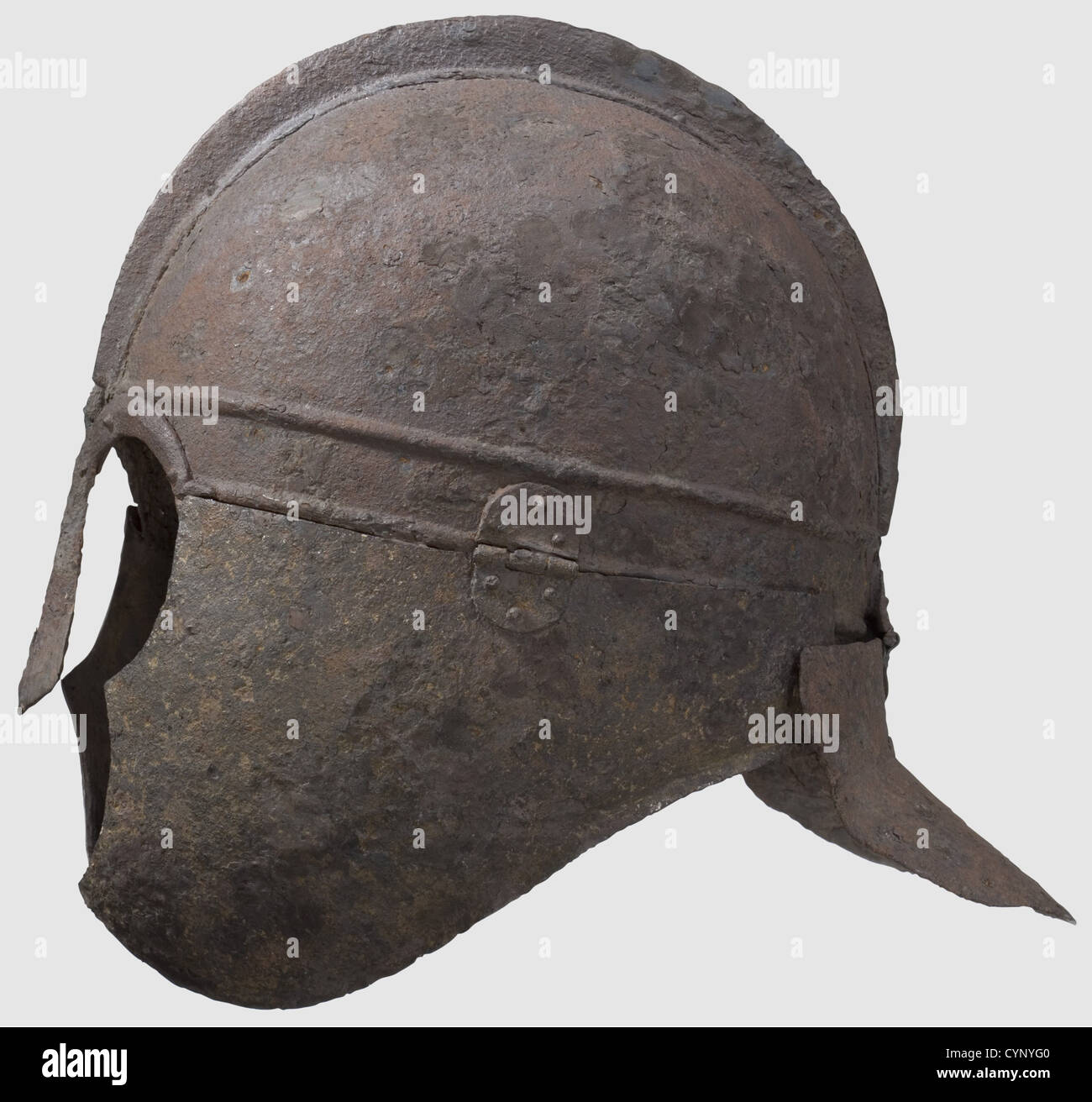 A late Roman iron helmet,circa 4th/5th century A.D.Formed of several sections hinged and riveted in place,the domed cap with a brow band off set by horizontal ribs,the two halves of the cap joined to a central ridge by rivets,the nose-guard and ornamental arching brows riveted to the brow band,the cheek-pieces flanged toward the neck and hinged to the brow band,each perforated below the chin,the neck-guard with an everted hemispherical flange hinged to the back of the brow band Height 27.5 cm,Weight 1426 grams.Provenance: American Private Collection,,Additional-Rights-Clearences-Not Available Stock Photo