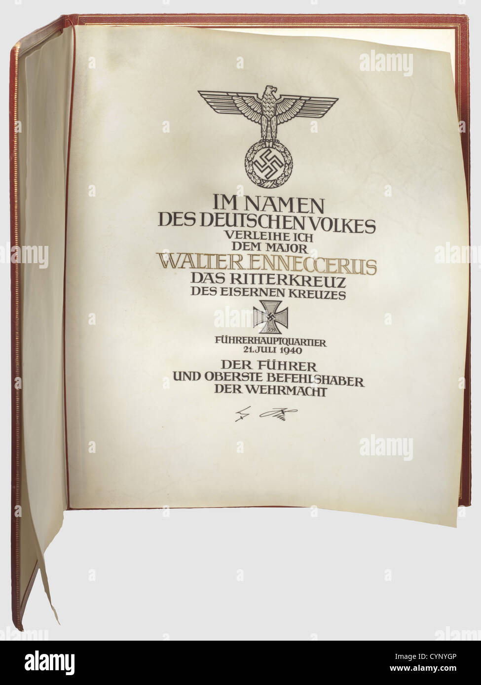 Hauptmann Walter Ennecerus - an award certificate and folder for the Knight's Cross of the Iron Cross 1939 dated 21 Juli 1940,A large format,double-sheet,parchment document with the text of the citation in black ink calligraphy and raised gold over Hitler's signature in ink. Very well preserved,the parchment is lightly spotted and the material shows some undulation. In the original award folder of red leather with gold-stamped decoration,the right side of the pa historic,historical,1930s,20th century,Air Force,branch of service,branches of service,a,Additional-Rights-Clearences-Not Available Stock Photo