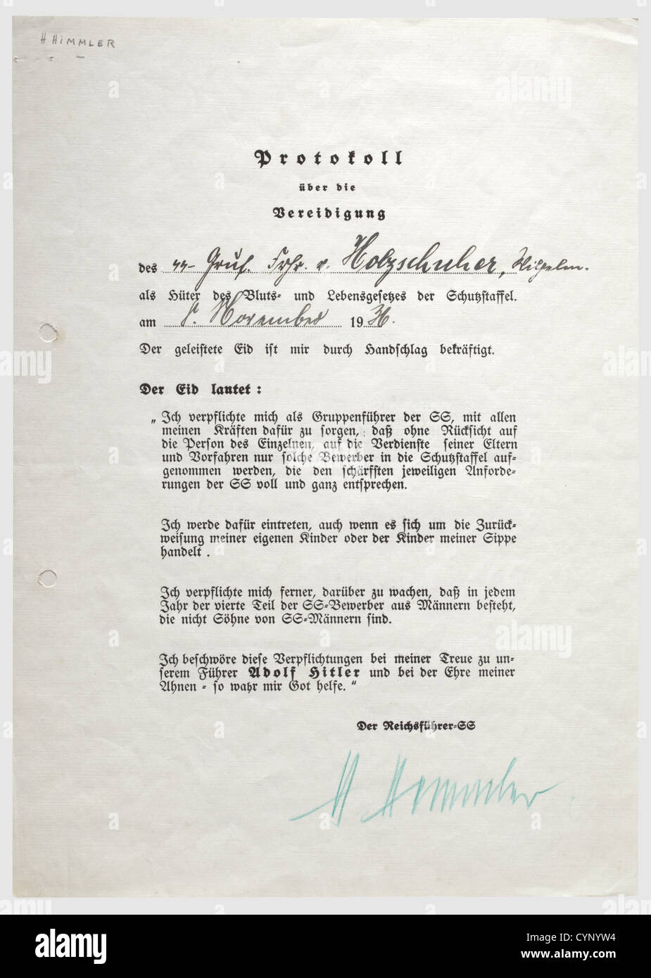 Heinrich Himmler - 'Protocol on the swearing-in ceremony of SS Gruppenführer Freiherr von Holzschuher,as Keeper of the Blood and Life Law of the Schutzstaffel'. Preprinted form with the oath,rank,name,and date '8. November 1936' written in ink. The lower edge with the handwritten ink signature 'H. Himmler' in green indelible pencil. Punched(glued from the back). Rare document. Wilhelm Freiherr von Holzschuher was appointed SS Gruppenführer in 1934 and Chief of the Settling Office in the RuSHA in 1939,historic,historical,1930s,20th century,autograph,a,Additional-Rights-Clearences-Not Available Stock Photo