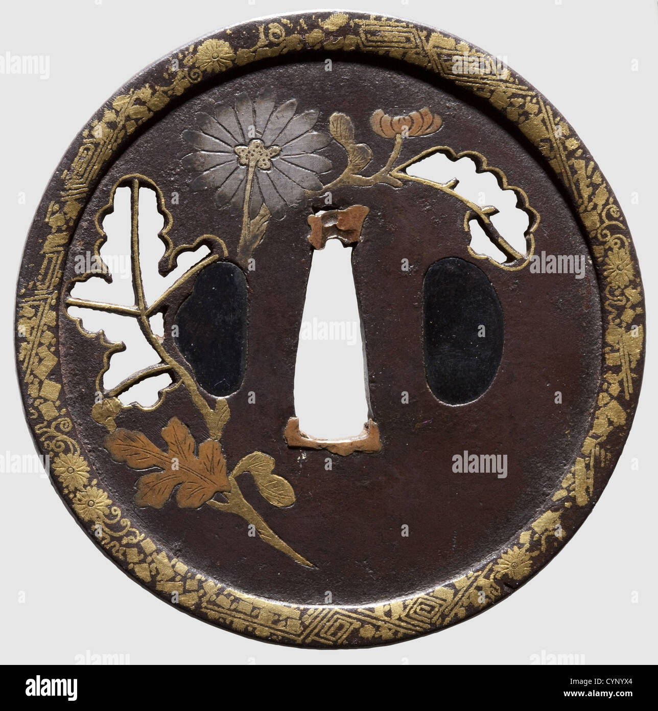 A tsuba,Japan,mid-Edo period. Iron marugata tsuba,probably a work from Awa Province. Raised rim with geometrical and floral decoration in gold nunome-zogan. The plate tapering slightly to the rim with a negative peony leaf sukashi,the edges and veins applied with gilt copper. Peony blossoms and leaves in hira-zogan in engraved copper,gold and silver. Diameter 8 cm,historic,historical,18th century,Japanese,Asian,Asia,Far East,object,objects,stills,clipping,clippings,cut out,cut-out,cut-outs,fine arts,art,art object,art objects,artful,pr,Additional-Rights-Clearences-Not Available Stock Photo