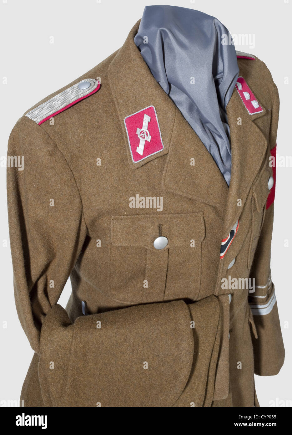 A uniform of an Untersturmführer in the Standarte 'Feldherrnhalle',Jacket of brown woolen material with silver buttons,the brown silk liner with RZM label 'SA-Dienstrock' and size stamping '48' in the inner pocket.Crimson red collar patches with braided silver cord piping,on the right side applied silver 'Opfer Rune',sewn-in shoulder boards with silver cello embroidery and crimson red liner.Woven,brown sleeve title(so-called 'BeVo Ausführung')with silver-grey cello edge striping and inscription in Sütterlin script 'Feldherrnhalle',the cuffs with 4 and,Additional-Rights-Clearences-Not Available Stock Photo