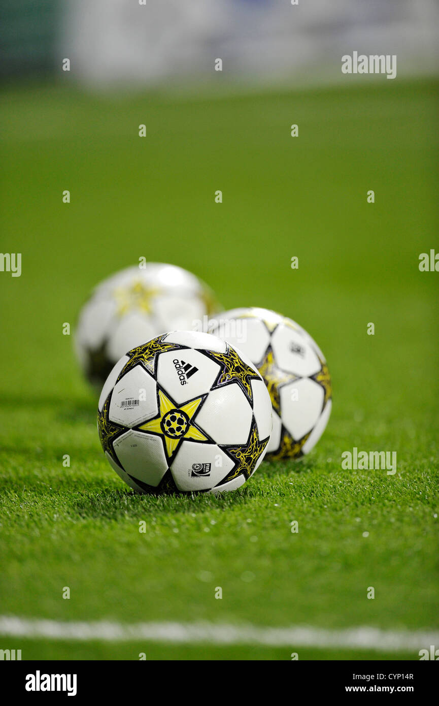 three UEFA Champions League Balls Adidas Finale 12 OMB on football pitch  Stock Photo - Alamy