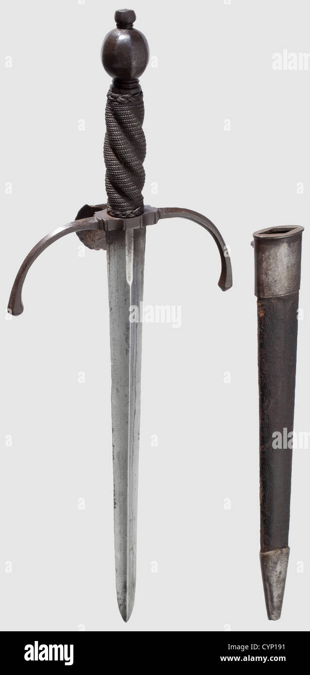 An Italian left-hand dagger,circa 1600. Double-edged blade with a pronounced central ridge on either side,recessed at the forte on one side. Quillons of hexagonal section curving towards the blade. Shell-shaped guard on the obverse side. Helically fluted grip with iron wire winding and Turk's heads. Oval nine-sided pommel. Original scabbard covered with shagreen leather,iron mountings,the locket fitted with a suspension loop. Length 42 cm,historic,historical,,17th century,dagger,daggers,thrusting,thrustings,baton,weapon,arms,weapons,arms,fighti,Additional-Rights-Clearences-Not Available Stock Photo