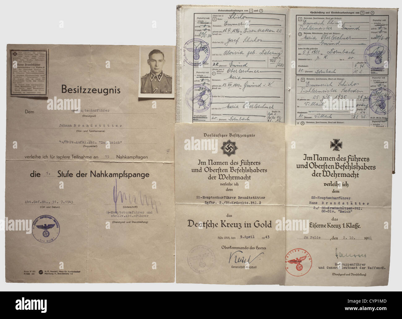 Documents of an SS-Hauptscharführer,in Motorised Rifle Battalion 'Das Reich'.Preliminary possession documents for the German Cross in Gold dated 9 April 1943,for the Close Combat Clasp 1st Class dated 31 July 1943 and for the Wound Badge in Silver dated 3 March 1943 as well as the award document for the Iron Cross 1st Class of 1939 dated 2 October 1941 with signature in ink of Hausser.Folded.Included is an ID photo,an obituary dated 26 August 1943,birth and baptismal certificates,marriage document and proof of ancestry,historic,historical,people,193,Additional-Rights-Clearences-Not Available Stock Photo