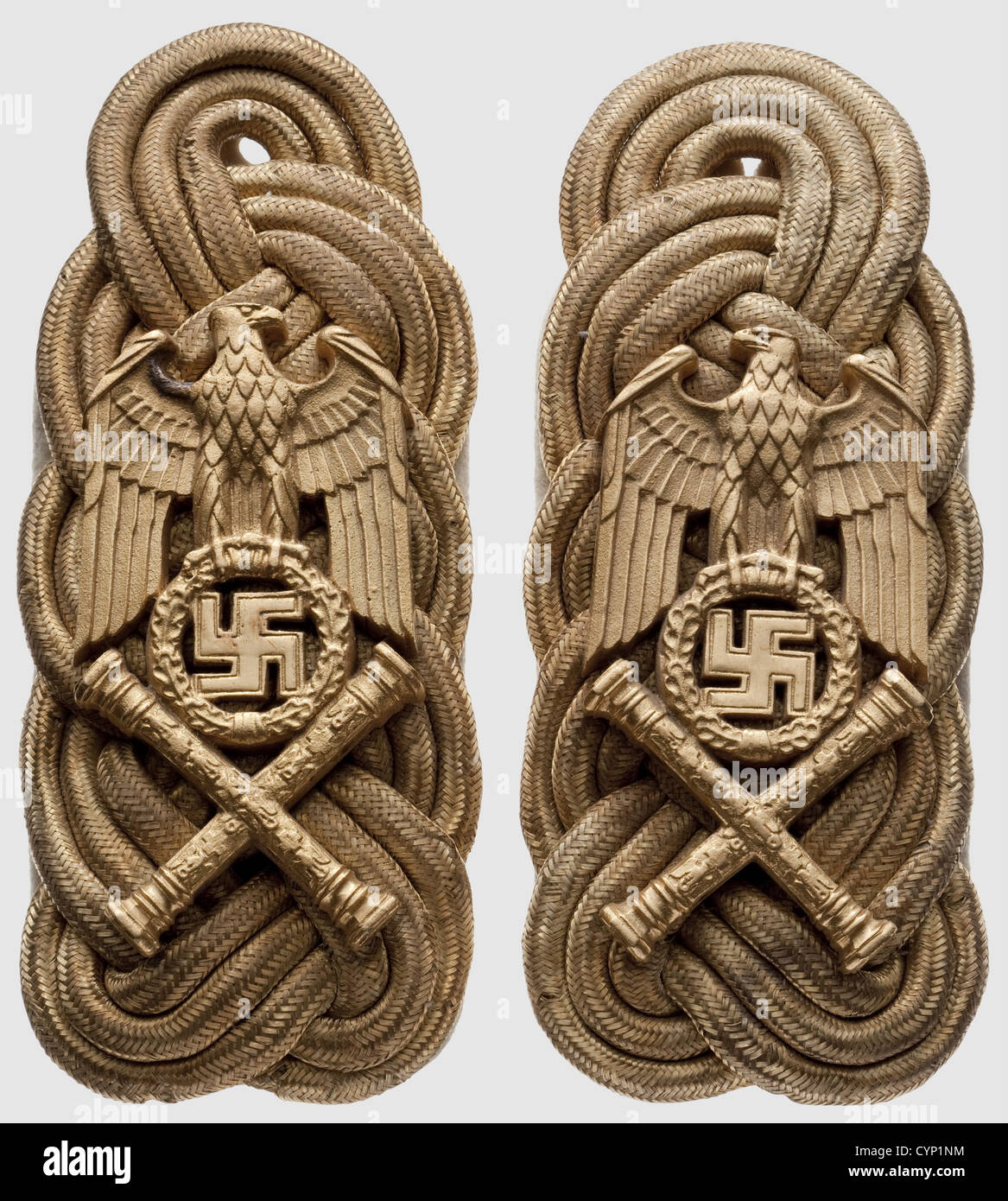 Hermann Göring - a pair of shoulder boards as Reich Marshal,Large pattern for the coat.Woven of three round golden cords alongside each other on a white backing with loops,bearing the eagle looking forward above crossed marshal's batons.Bronze,fire-gilt,and polished on the edges.Including the tieable white linen coating.Cf.Johnson,'World War II German War Booty',vol.IV,p.105.Extremely rare.For the crucial victories of the German Luftwaffe during the campaign in France and in order to emphasise Hermann Göring's position as the highest ranking Ger,Additional-Rights-Clearences-Not Available Stock Photo