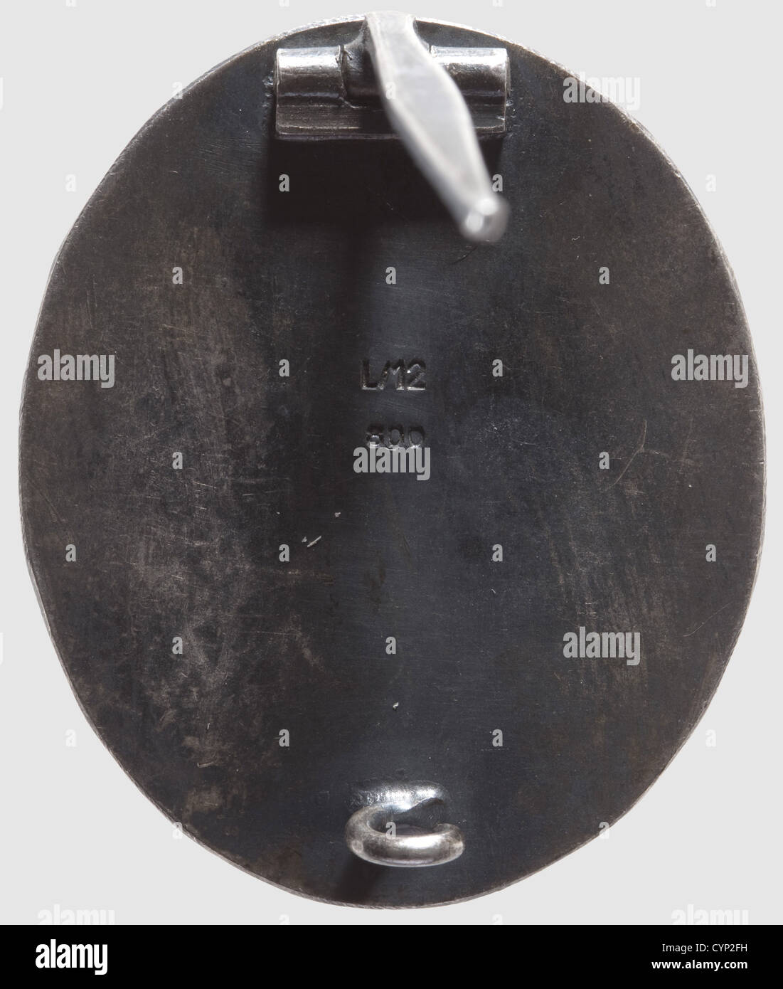 Wound Badge "20 July 1944" in Black,Silver,partially patinated and polished.Marked "L/12" for Juncker and "800" on the reverse side.The patina is somewhat worn off,otherwise in outstanding condition.Dimensions 44.54 x 37.18 mm.Weight 39.77 grams(Nie 7.04.16).Extremely rare.Only 23 or 24 have been awarded in the three levels,gold,silver,and black.Two of which are confirmed of silver level to Staff Lt.Col.Heinrich Borgmann,Adjutant of the Wehrmacht,and to SS-Gruppenführer and General of the Waffen-SS Hermann Fegelein.A Wound Badge in Black was ,Additional-Rights-Clearences-Not Available Stock Photo