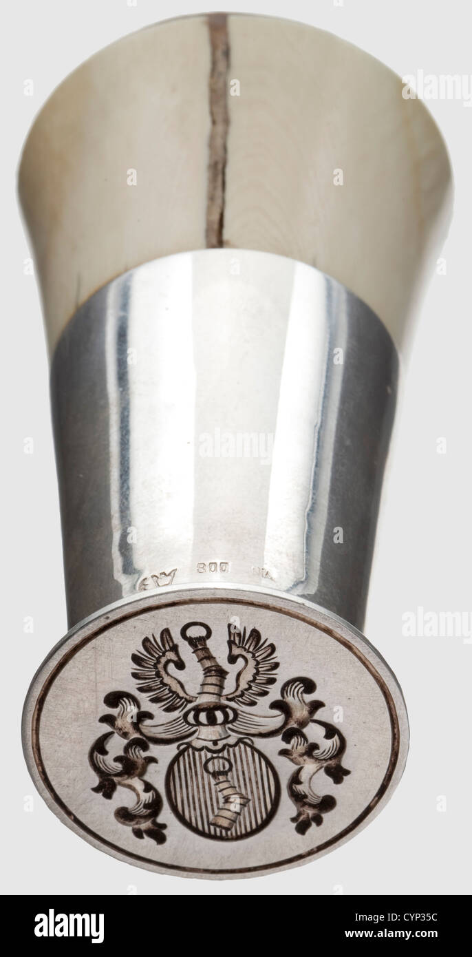 Hermann Göring - a personal seal,circa 1915.Silver and ivory.Conical handle,the cap with the portrayal of a horseman in silver and black enamel.A large version of Göring's coat of arms cut into the silver seal matrix.German hallmark '800' with crescent and crown and unclear mark 'NW'(?).The ivory with crack and preserving repair.Height 8 cm.Beautiful early seal of Göring.Comparisons between the present seal matrix and the preserved wax impressions on the envelopes of lot T 1481(his love letters to Carin)show that this seal was in use in late 1921,a,Additional-Rights-Clearences-Not Available Stock Photo