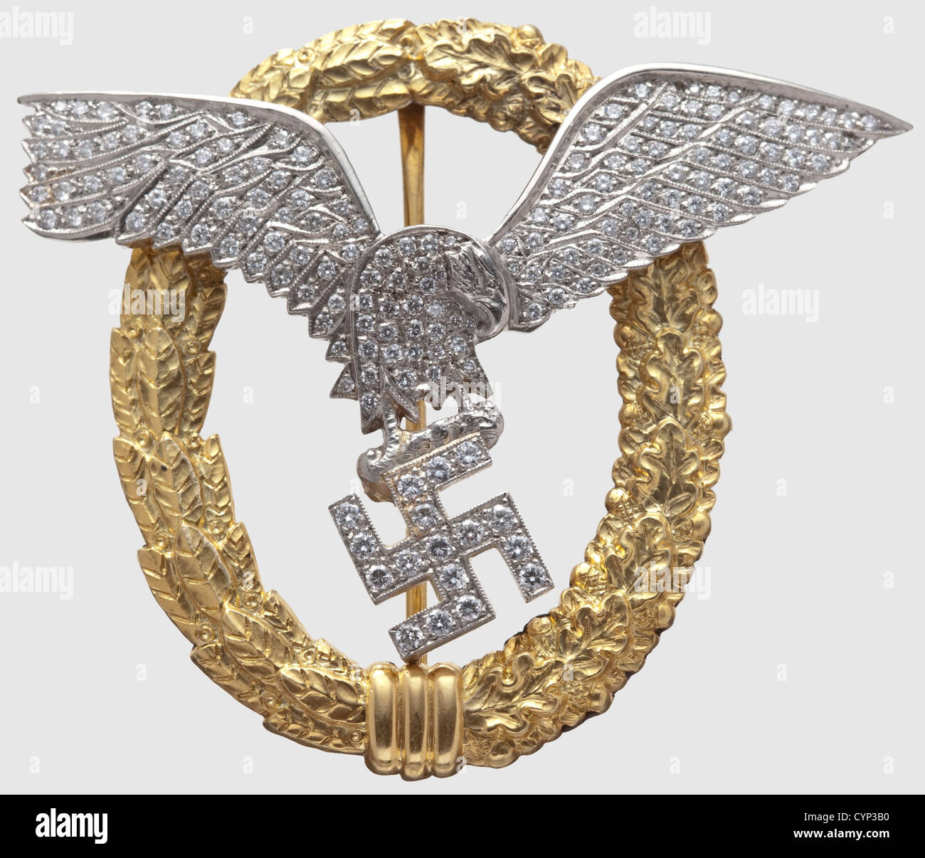 Admiral Miklós Horthy von Nagybánya(1868 - 1957)- a Combined Pilots and Observers Badge in Gold with Diamonds,The oak leaf and laurel wreath in gold,marked '585',the domed eagle and the swastika of platinum,adorned with more than 160 diamonds set à jour(one missing),assembled with two slit nuts on soldered threaded pins,the perimeter of the eagle reinforced on the reverse side by a gold-plated frame.The swastika pinned to the wreath binding at the bottom of the wreath.The attachment needle fitted with a roller hinge and a safety catch.Weight 45.67 g,Additional-Rights-Clearences-Not Available Stock Photo