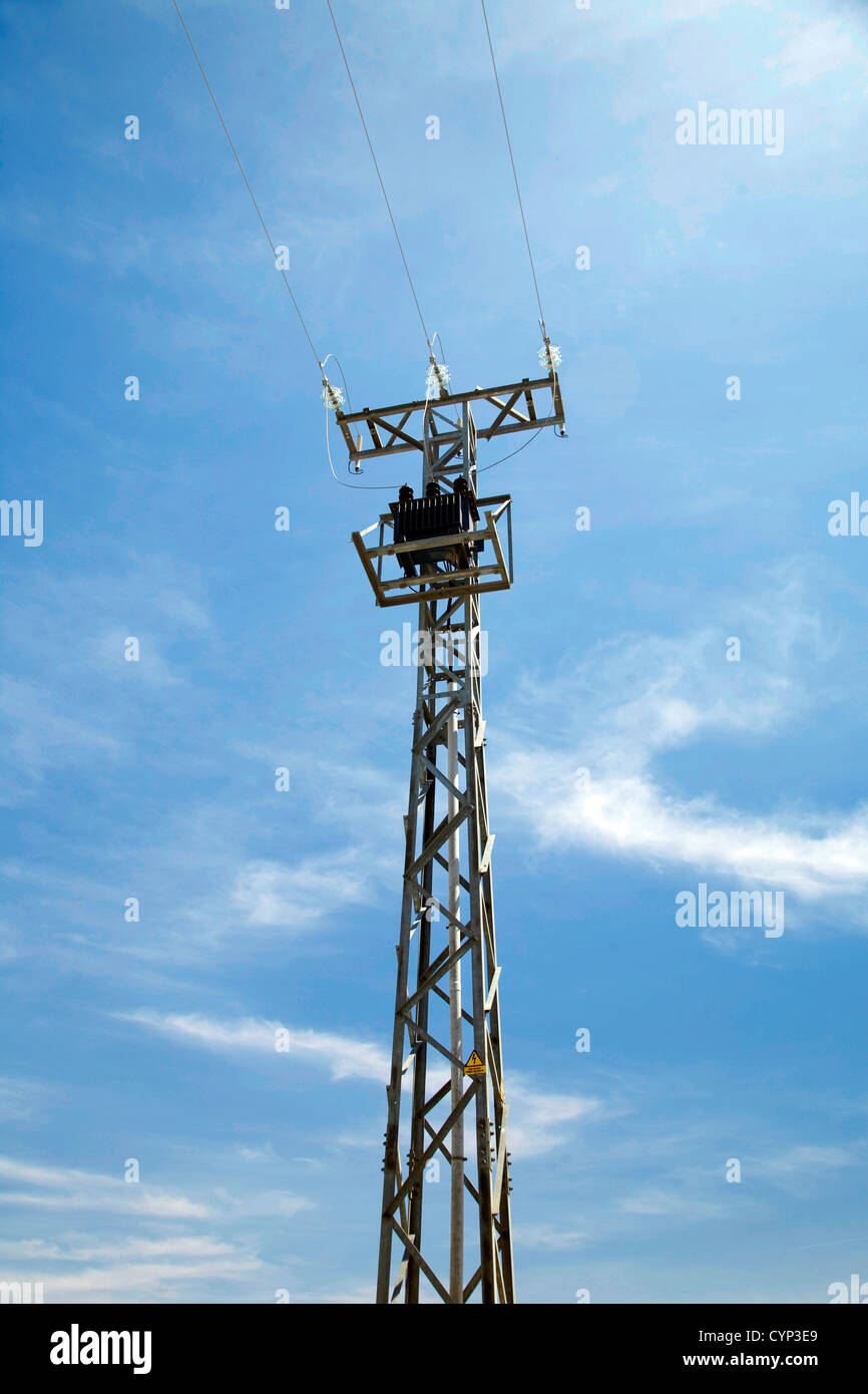 electricity tower with the blue sky behind Stock Photo - Alamy