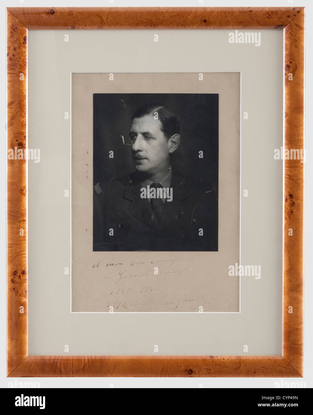 General Charles de Gaulle (1890 - 1970) - a photo with dedication to General Koenig, 1945, Portrait photo of de Gaulle in a general's uniform with the two badges of the Forces Fran‡aises Libres ('moustique' and 'perchoir'). Handwritten dedication in dark ink 'A mon bon compagnon, le général Koenig 1940 - 1945. 23/1/45 C. de Gaulle'. Photographer's signature 'Tayer' on the lower left. Small scratches. 31 x 22 cm, framed and under glass, dimensions 48 x 39 cm. Highly significant photo document of the Head of the Free French Forces to Koenig (1898 - 1970), who off, Stock Photo