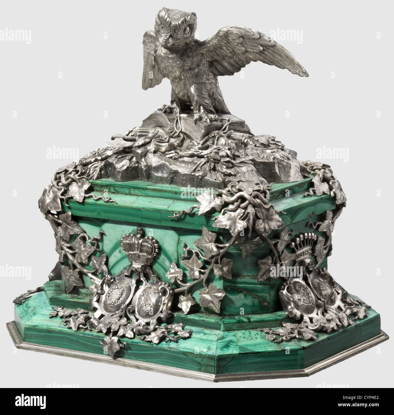 Karl Philipp Fürst von Wrede(1767 - 1838)- a gift of honour,Table centrepiece,massive,oblong rectangular,tiered malachite base with slate core and bevelled corners,20 x 15 cm,height of the base ca. 9 cm. The base entwined by ivy foliage,surmounted by an owl perched on a book decorated with symbols of justice,scales,sword,and fasces(referring to Wrede's former law studies)as well as a coat of arms,probably the primary of a 'Reichsfreiherr'(Reich Baron). The front with the ducal coat of arms of Wrede and his wife,on either side combined coat of a,Additional-Rights-Clearences-Not Available Stock Photo