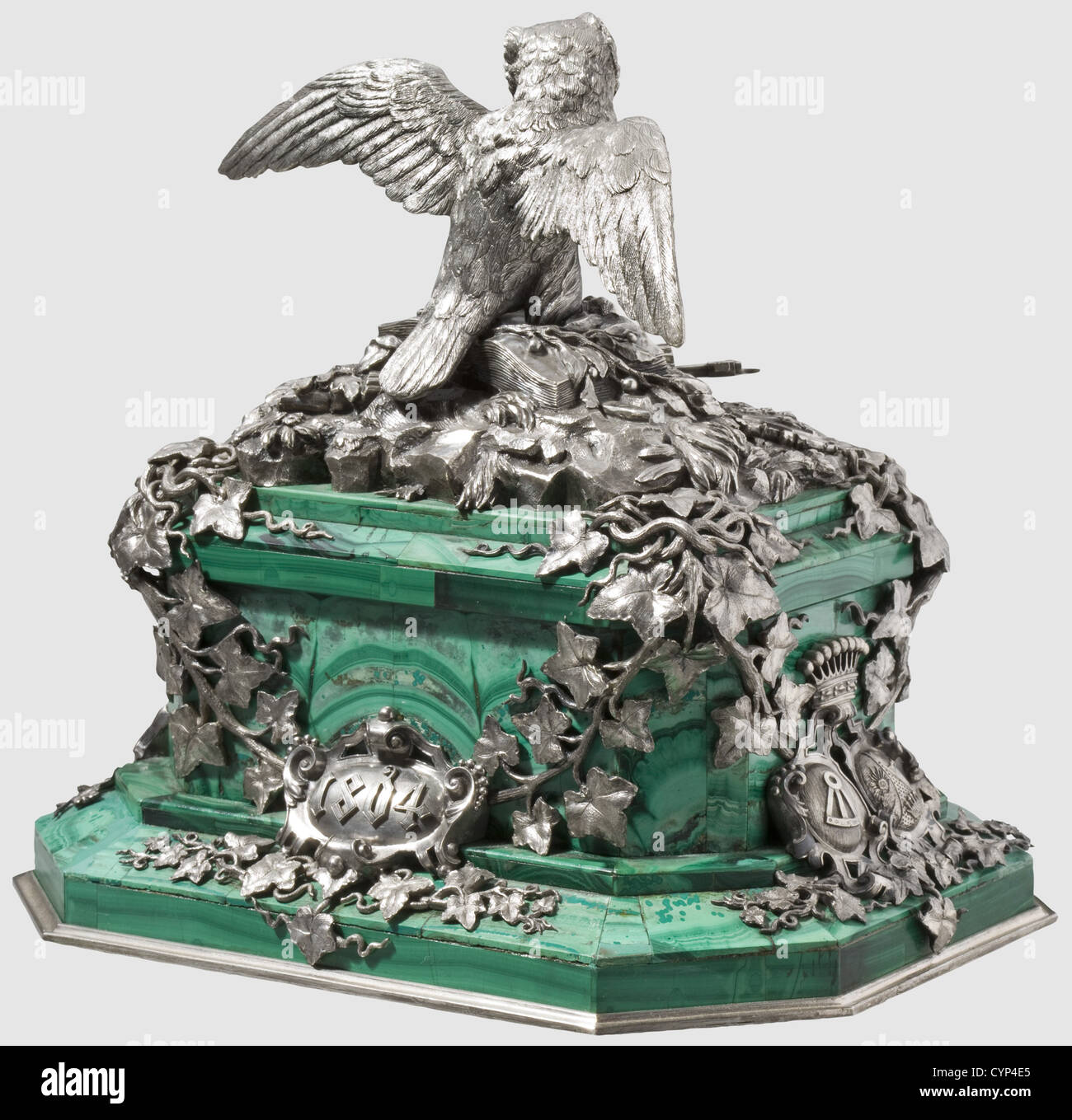 Karl Philipp Fürst von Wrede(1767 - 1838)- a gift of honour,Table centrepiece,massive,oblong rectangular,tiered malachite base with slate core and bevelled corners,20 x 15 cm,height of the base ca. 9 cm. The base entwined by ivy foliage,surmounted by an owl perched on a book decorated with symbols of justice,scales,sword,and fasces(referring to Wrede's former law studies)as well as a coat of arms,probably the primary of a 'Reichsfreiherr'(Reich Baron). The front with the ducal coat of arms of Wrede and his wife,on either side combined coat of a,Additional-Rights-Clearences-Not Available Stock Photo
