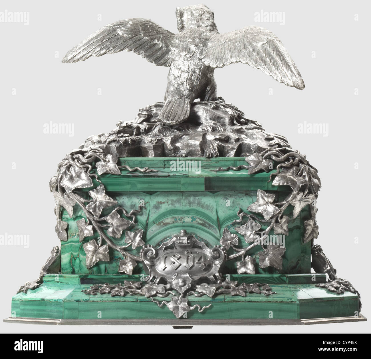 Karl Philipp Fürst von Wrede(1767 - 1838)- a gift of honour,Table centrepiece,massive,oblong rectangular,tiered malachite base with slate core and bevelled corners,20 x 15 cm,height of the base ca. 9 cm. The base entwined by ivy foliage,surmounted by an owl perched on a book decorated with symbols of justice,scales,sword,and fasces(referring to Wrede's former law studies)as well as a coat of arms,probably the primary of a 'Reichsfreiherr'(Reich Baron). The front with the ducal coat of arms of Wrede and his wife,on either side combined coat of a,Additional-Rights-Clearences-Not Available Stock Photo