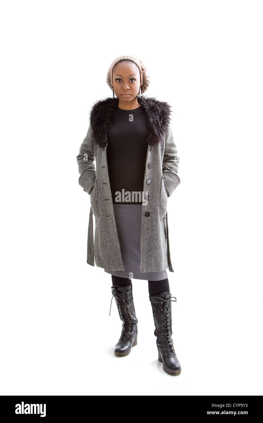 Beautiful African woman wearing gray winter wear, isolated Stock Photo