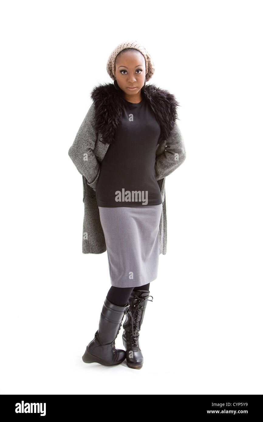 Beautiful African woman wearing gray winter wear, isolated Stock Photo