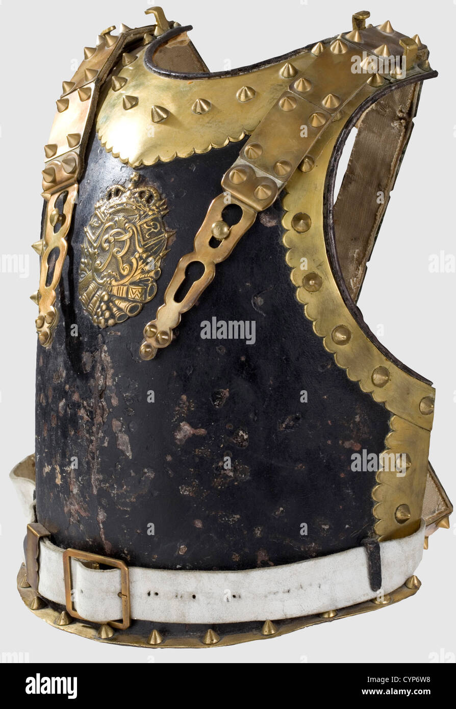 A cuirass for officers,circa 1740. Blackened,slightly ridged forged iron breastplate,brass bordered edge with domed rivets and strapping hooks. The black paint splintered in places,the breastplate emblem is an old plated replica. Modern attachment straps with brass fittings. Weight 2,320 g,historic,historical,18th century,Prussian,Prussia,German,Germany,militaria,military,object,objects,stills,clipping,clippings,cut out,cut-out,cut-outs,uniform,uniforms,piece of clothing,clothes,outfit,outfits,plating,armour-plating,armour,armor,,Additional-Rights-Clearences-Not Available Stock Photo