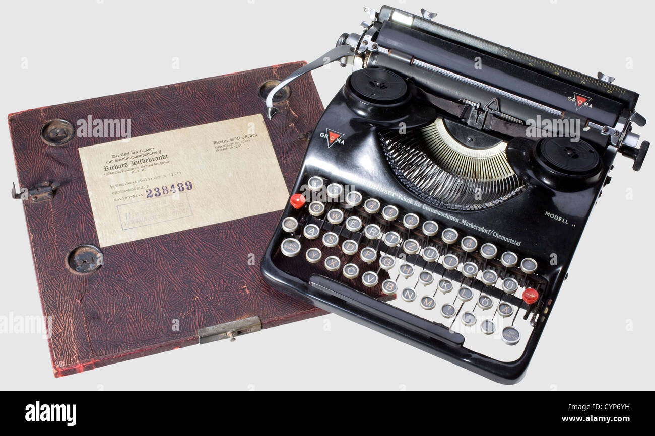 A Groma typewriter model 'N' from Race and Settlement Office SS,Functioning typewriter with 'SS' symbol on number key '3'.In a slightly damaged box covered with dark red artificial leather(leather strap handle torn).The base of box with label 'The Head of Race and Settlement Office SS Richard Hildebrandt' with serial number and SS reg.no.as well as stamp 'Property of SS Office for Economy and Administration'(quotes transl.).The typewriter was a present from HIAG to Gustav Lombard,former SS brigade leader and ,Additional-Rights-Clearences-Not Available Stock Photo