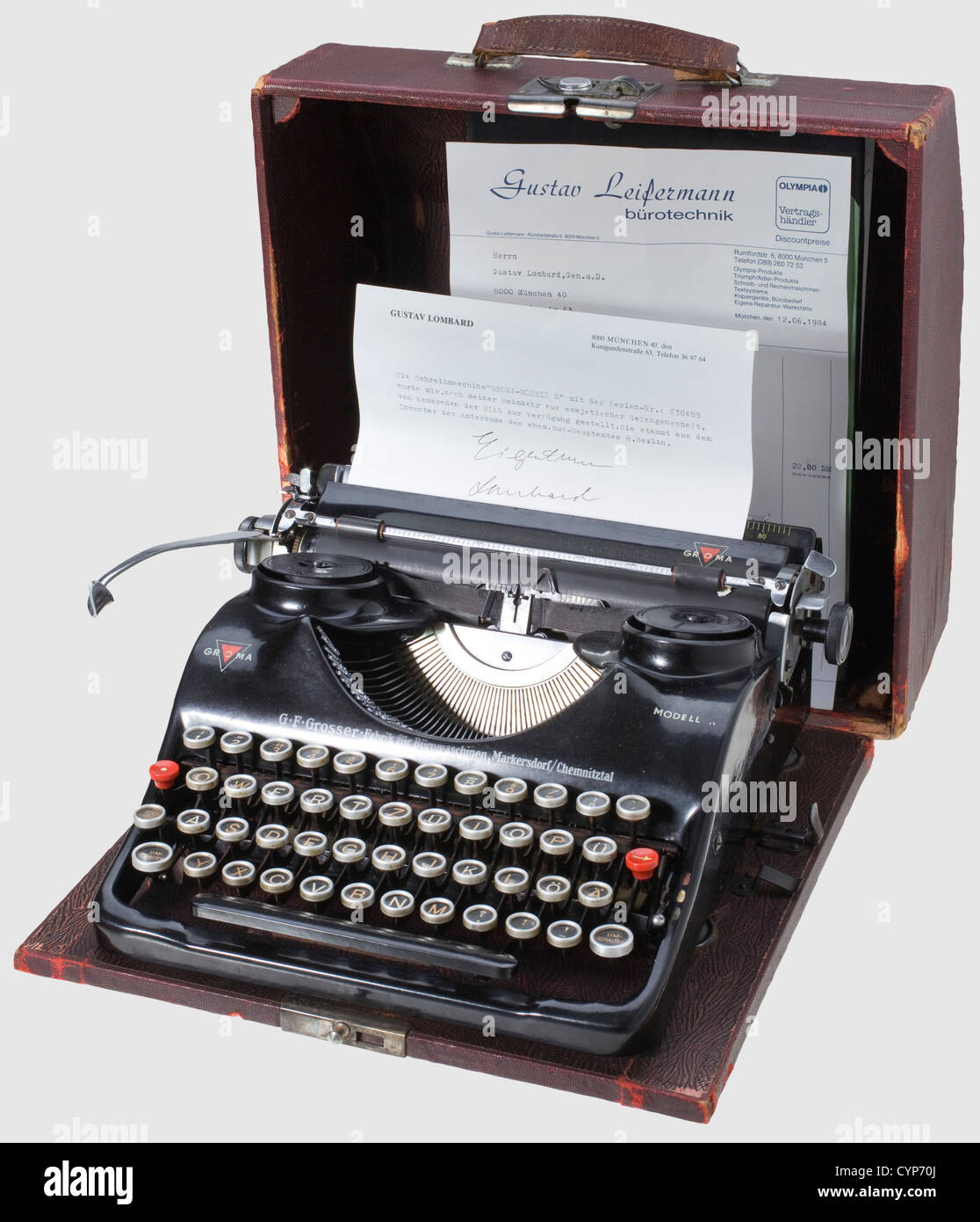 A Groma typewriter model 'N' from Race and Settlement Office SS,Functioning typewriter with 'SS' symbol on number key '3'.In a slightly damaged box covered with dark red artificial leather(leather strap handle torn).The base of box with label 'The Head of Race and Settlement Office SS Richard Hildebrandt' with serial number and SS reg.no.as well as stamp 'Property of SS Office for Economy and Administration'(quotes transl.).The typewriter was a present from HIAG to Gustav Lombard,former SS brigade leader and ,Additional-Rights-Clearences-Not Available Stock Photo