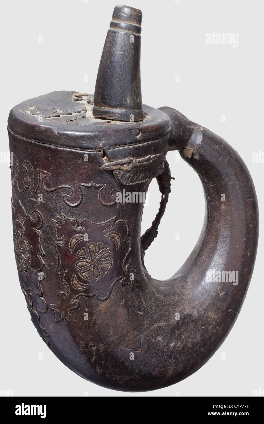 An Ottoman powder flask, 16th/17th century. Distinctly curved, leather-coated horn body with conical spout also made from horn. The upper part with ornamental leather applications. The leather coating with a larger defect on the reverse side. Height 24.5 cm. Rare powder flask from the time of the Ottoman wars, historic, historical,, 17th century, 16th century, Ottoman Empire, object, objects, stills, clipping, clippings, cut out, cut-out, cut-outs, vessel, vessels, Additional-Rights-Clearences-Not Available Stock Photo