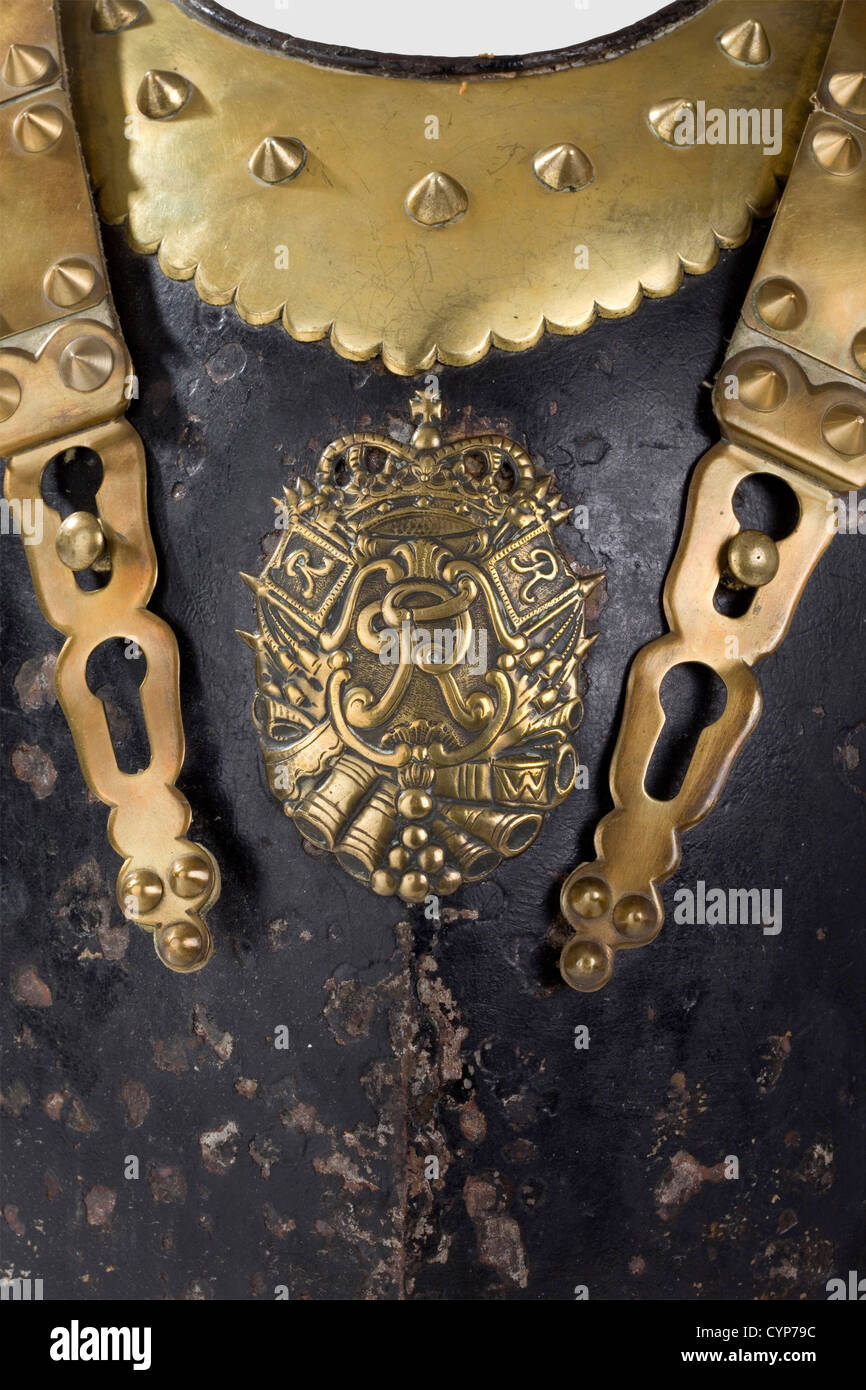 A cuirass for officers,circa 1740. Blackened,slightly ridged forged iron breastplate,brass bordered edge with domed rivets and strapping hooks. The black paint splintered in places,the breastplate emblem is an old plated replica. Modern attachment straps with brass fittings. Weight 2,320 g,historic,historical,18th century,Prussian,Prussia,German,Germany,militaria,military,object,objects,stills,clipping,clippings,cut out,cut-out,cut-outs,uniform,uniforms,piece of clothing,clothes,outfit,outfits,plating,armour-plating,armour,armor,,Additional-Rights-Clearences-Not Available Stock Photo