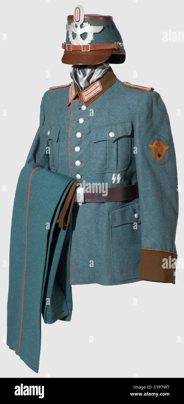 A uniform ensemble for an Oberwachtmeister,of Gendarmerie. Brown-lacquered fibreglass shako with police green cover(mothy),supplemented aluminium eagle and insignia. Field tunic of police green woolen fabric with brown facings and collars,orange-coloured piping and depot stamp. Insignia newly stitched. Long trousers of corresponding material with orange piping and depot stamp. Belt with aluminium buckle. NCO sword with nickel fittings,maker 'Krebs Solingen',SS NCO sword knot. Rusty,historic,historical,1930s,1930s,20th century,object,objects,stills,Additional-Rights-Clearences-Not Available Stock Photo