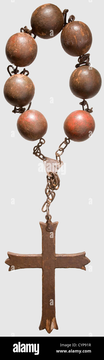 A rosary of shame,Southern German/Austrian,17th/18th century. Wood with reddish,slightly worn paint. Cross and seven 'pearls' connected by wrought iron chain links. Size of the cross: width 29 cm,height 40 cm. Overly negligent churchgoers were sentenced to wear a rosary of disgrace,sometimes over a period of a few days. Cf. Held,Inquisition,pp. 72 f. and Schild,Die Geschichte der Gerichtsbarkeit,fig. 528,historic,historical,,18th century,17th century,instrument of torture,torture device,instruments of torture,torture devices,object,objects,s,Additional-Rights-Clearences-Not Available Stock Photo