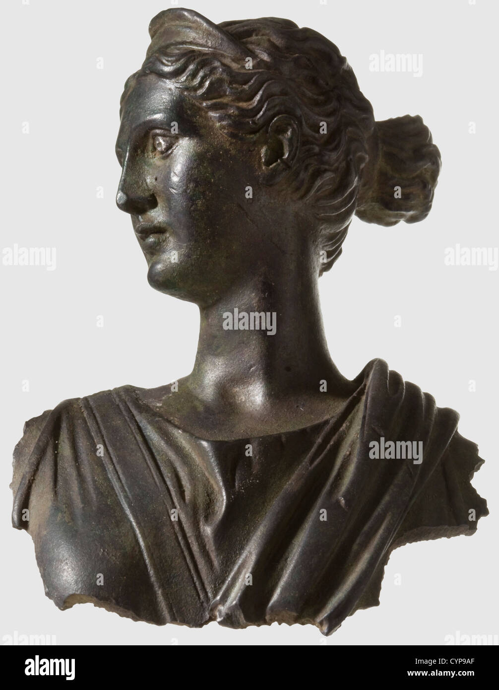A Roman female bust,1st/2nd century A.D. Bronze with fine,dark green patina. Fragment of a statue with jagged edges on the back,shoulders,and chest. Finely modelled head with silver inlaid eyes. Hair tied into a bun and with small tiara. Chiton and cloak in well defined folds. Cleaned archaeological find,mounted on an acrylic glass base. Height without base 9.5 cm,historic,historical,ancient world,ancient world,ancient times,object,objects,stills,clipping,cut out,cut-out,cut-outs,sculpture,sculptures,statuette,figurine,figurines,statuette,Additional-Rights-Clearences-Not Available Stock Photo