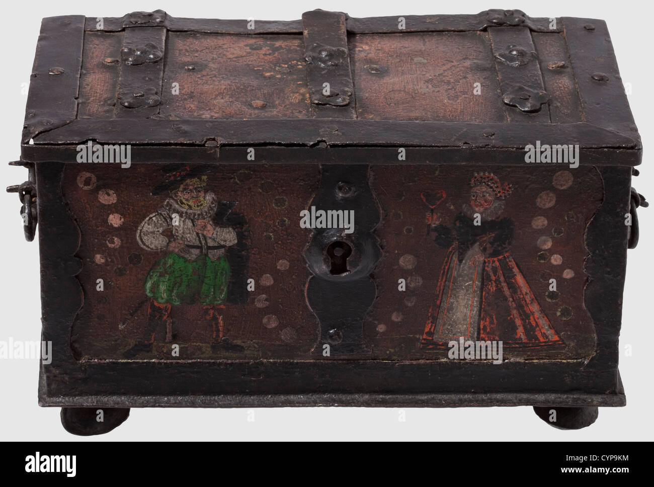 An iron casket,Nuremberg,ca.1620.Rectangular casket with a hinged lid.On the lid a covered keyhole.On the interior of the lid a lock mechanism with four latches and partially engraved cover plates.The key a replacement.Separate interior compartment with spring-loaded closing mechanism.The front side bearing a false lock,the sides with movable handles.Four flattened ball feet.Red and black colour coating,the front side decorated with a standing couple dressed in contemporary costumes.Size 16 x 26 x 14 cm,historic,historical,,17th century,handic,Additional-Rights-Clearences-Not Available Stock Photo