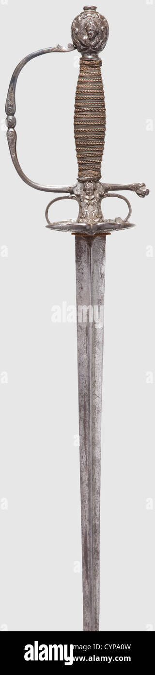 A French small-sword,early 18th century. Tapered thrusting blade of hollow-triangular section,the forte shows remnants of etched floral ornaments,slightly stained. Chiselled iron hilt with fine,half-relief decoration of antique style(handguard added later). Grip elaborately wound in copper wire with Turk's heads. Length 103 cm,historic,historical,18th century,sword,swords,weapons,arms,weapon,arm,fighting device,military,militaria,object,objects,stills,clipping,clippings,cut out,cut-out,cut-outs,melee weapon,melee weapons,metal,Additional-Rights-Clearences-Not Available Stock Photo
