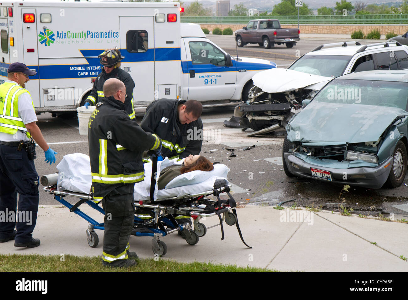 Paramedics and firefighters respond to an automobile injury accident in Boise, Idaho, USA. Stock Photo