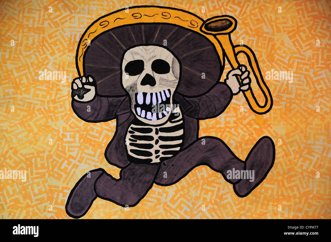 Mexico, Bajio, Queretaro, Day of The Dead wall art depicting skeleton in sombrero holding a trumpet. Stock Photo