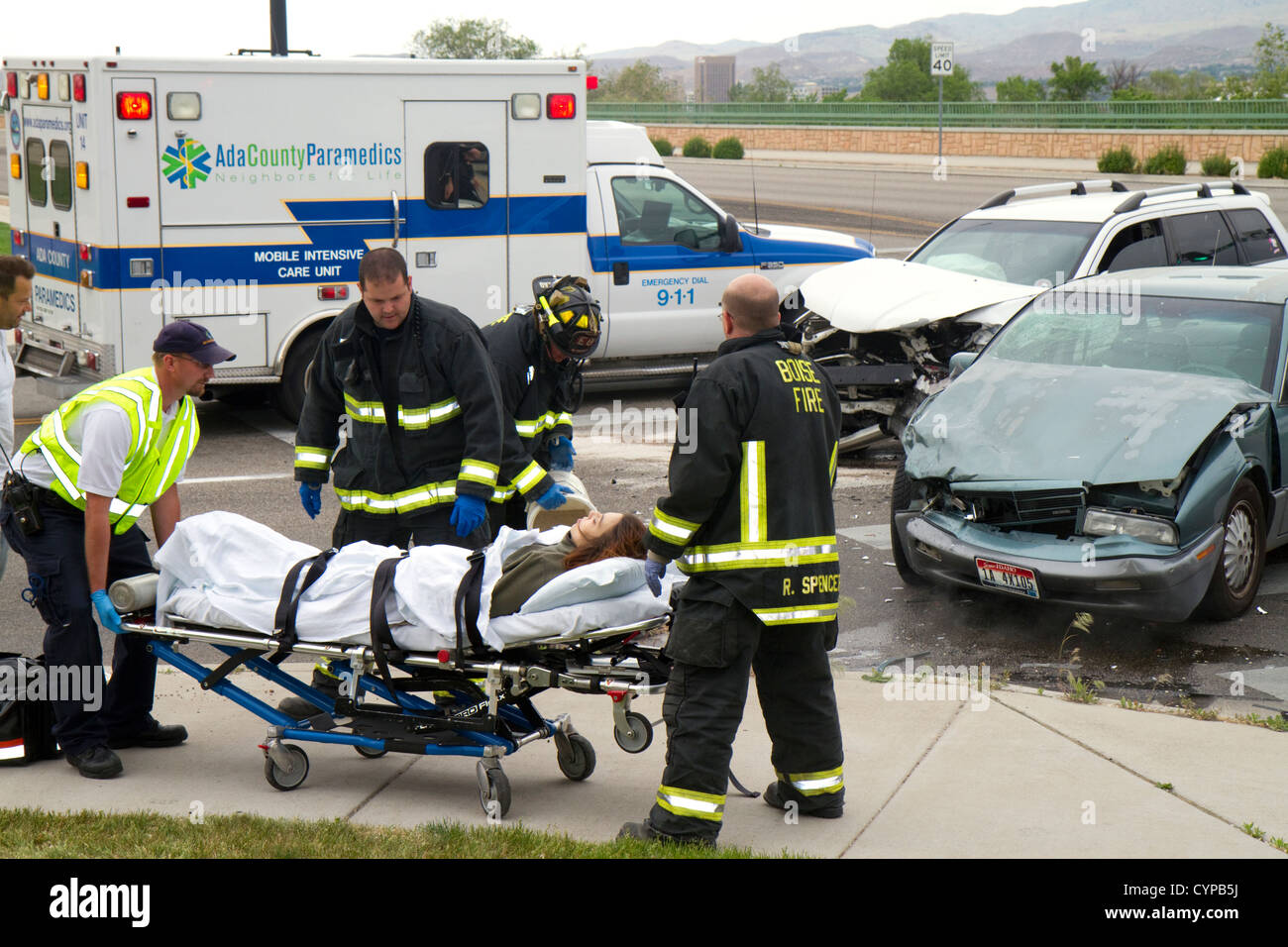 Paramedics and firefighters respond to an automobile injury accident in Boise, Idaho, USA. Stock Photo