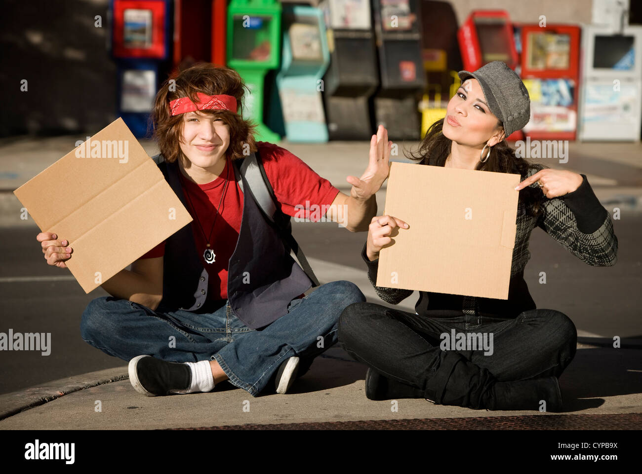 Attractive Young Man and Woman with Blank Cardboard Signs Stock Photo