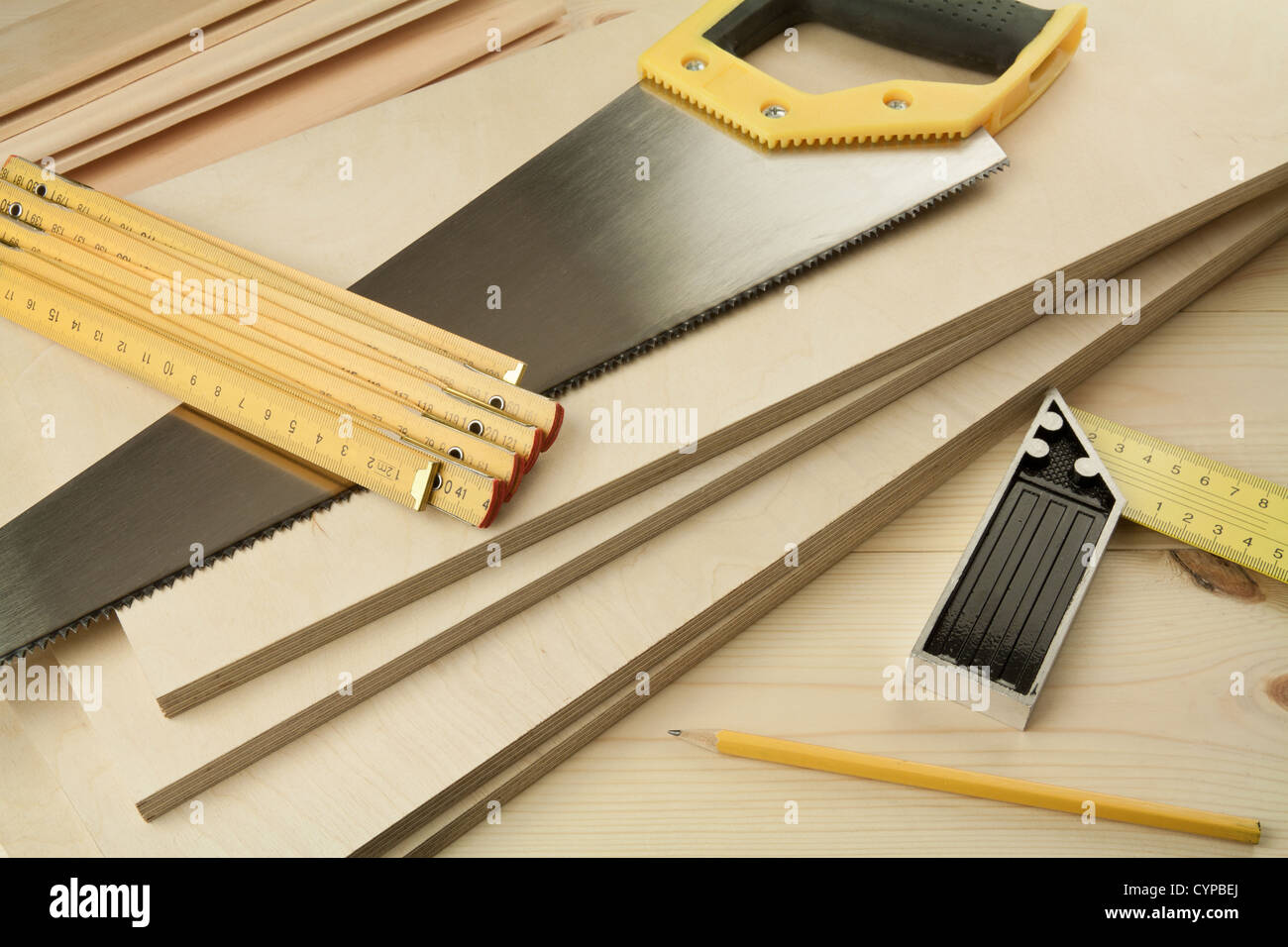 Wood working tools on a wooden boards background. Including saw, ruler ...