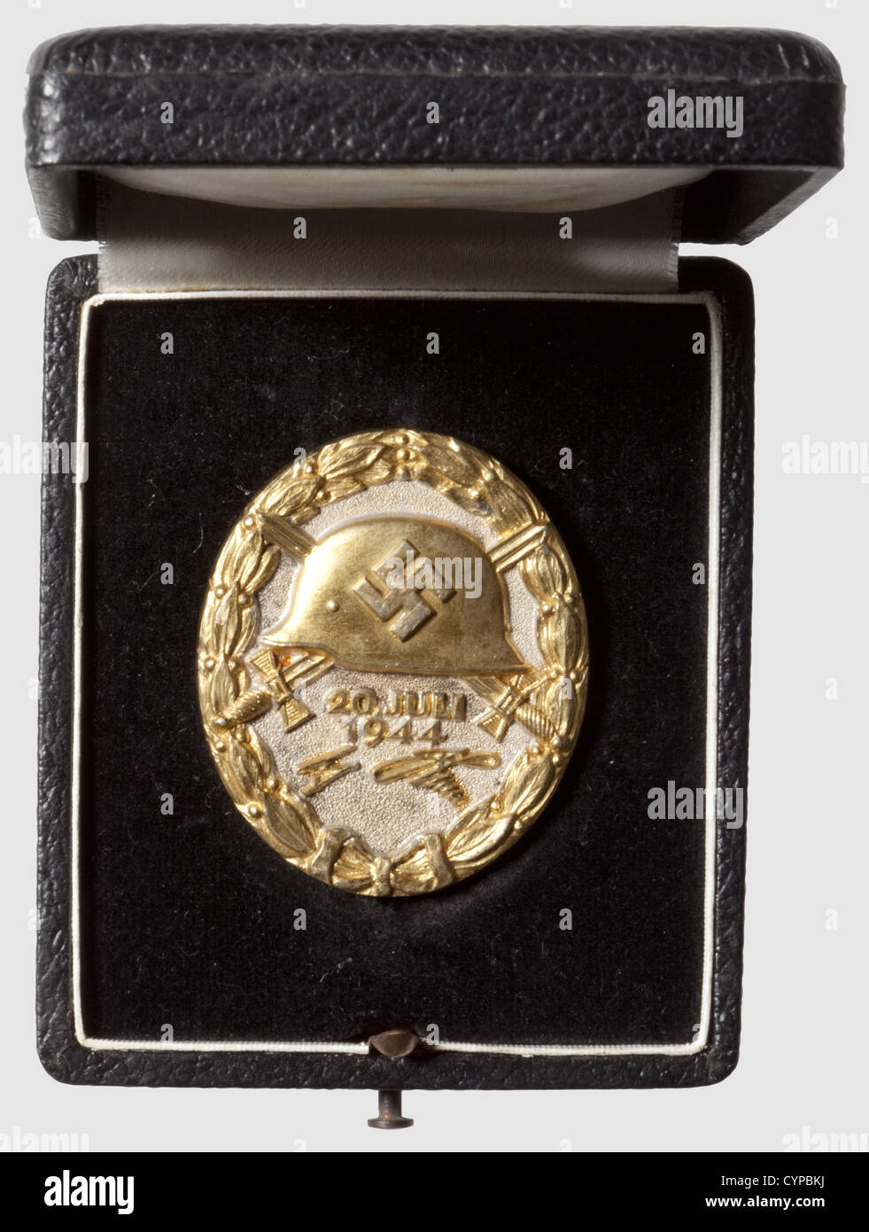 A Wound Badge "20 July 1944" in Gold,in its original case of issue Silver,partially gilded. Marked "800" and "2" for Juncker,Berlin,on the reverse side. The gilding slightly worn off,small scratches on the back(from assaying?),otherwise in outstanding condition. Dimensions 44.24 x 37.08 mm. Weight 35.65 grams(Nie 7.04.16 a1). In its original case of issue with black velvet and white silk lining. Extremely rare. Only 23 or 24 have been awarded in the three levels,gold,silver,and black. The gold level has presumably been awarded four times posthumously,Additional-Rights-Clearences-Not Available Stock Photo
