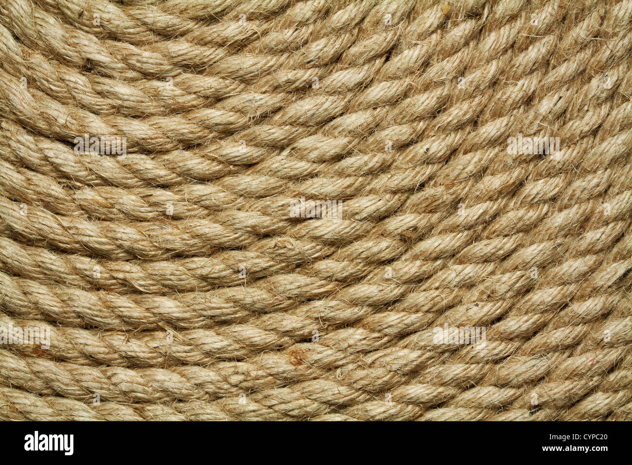 Roll of old rough rope, background Stock Photo - Alamy