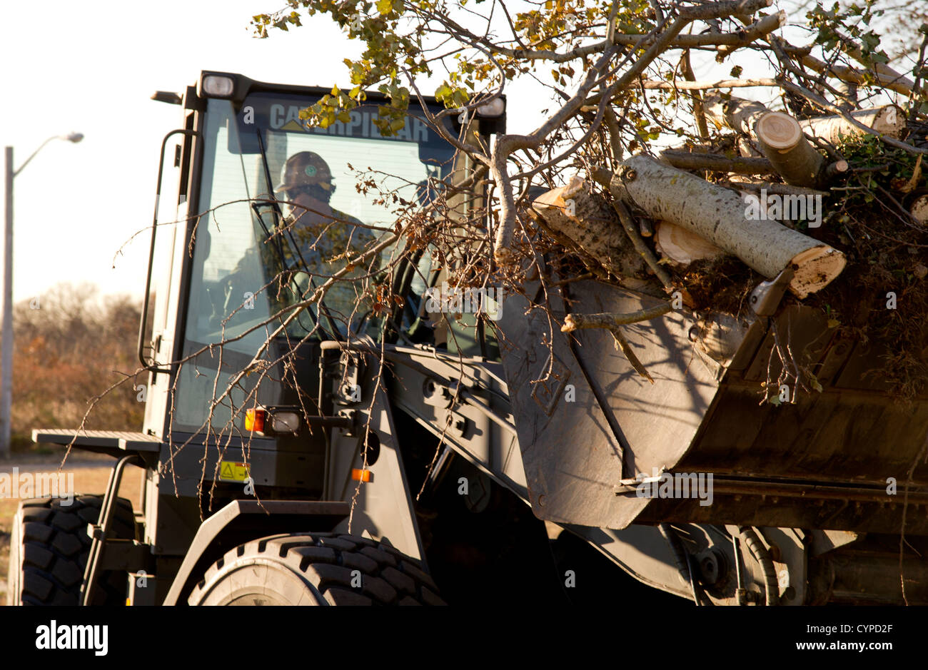 A Seabee from Construction Battalion Maintenance Unit 202 operates a ...