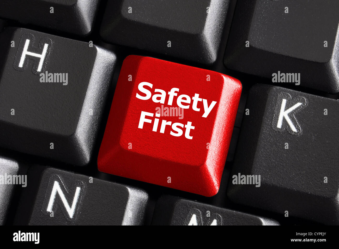 safety first concept with red key on computer keyboard Stock Photo - Alamy