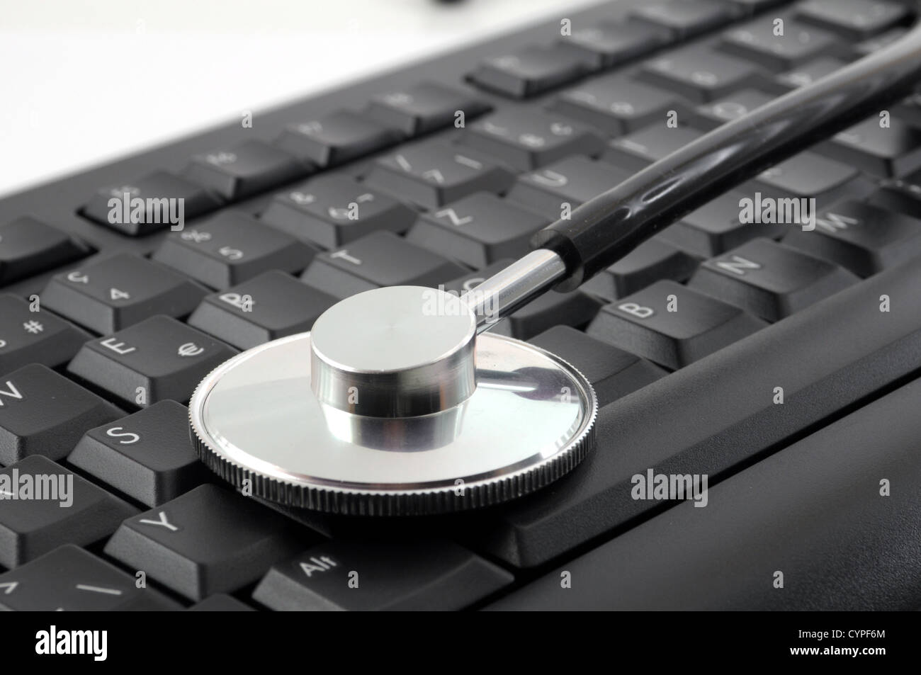 stethoscope on computer keyboard showing medical or pc support concept Stock Photo