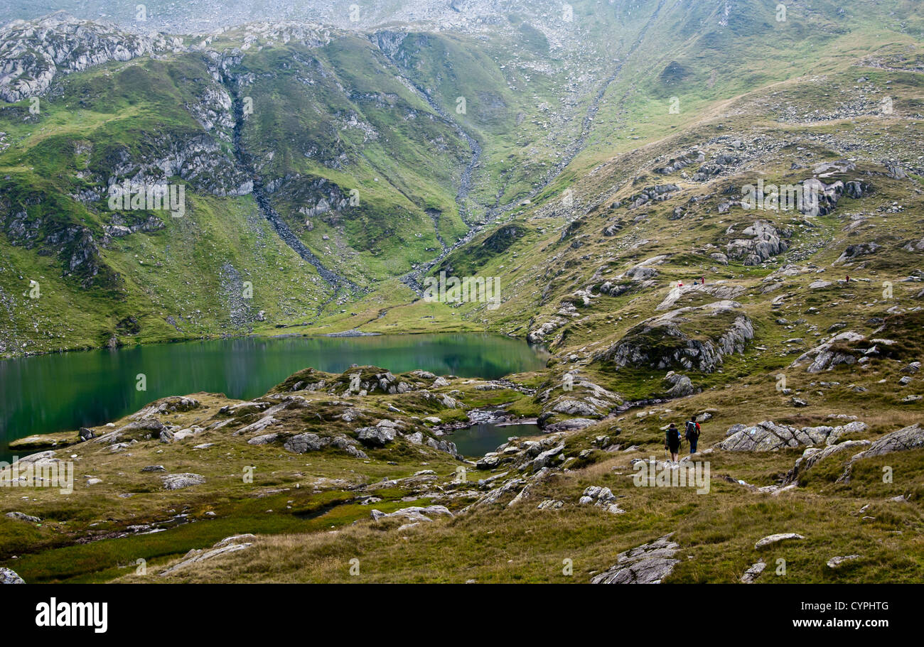 Mountainous landscape with a lake.  Location:Podragu Lake from Fagaras Mountains,Romania. Stock Photo
