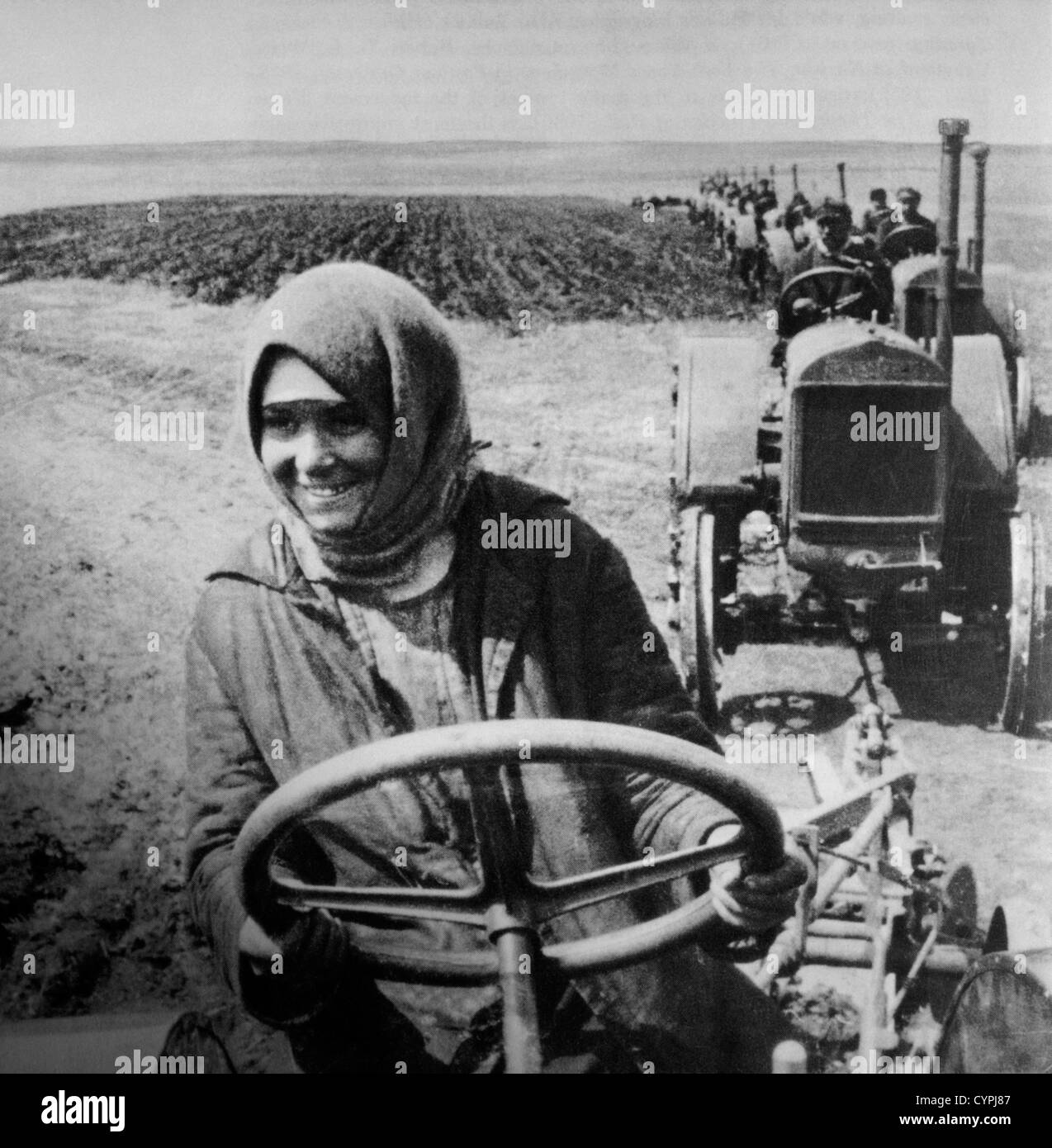 Woman Driving Tractor on Collective Farm, Soviet Union, 1928 Stock Photo