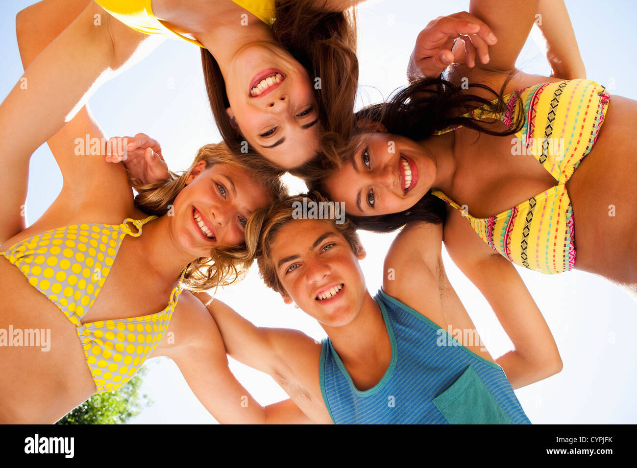 Friends hugging in circle Stock Photo