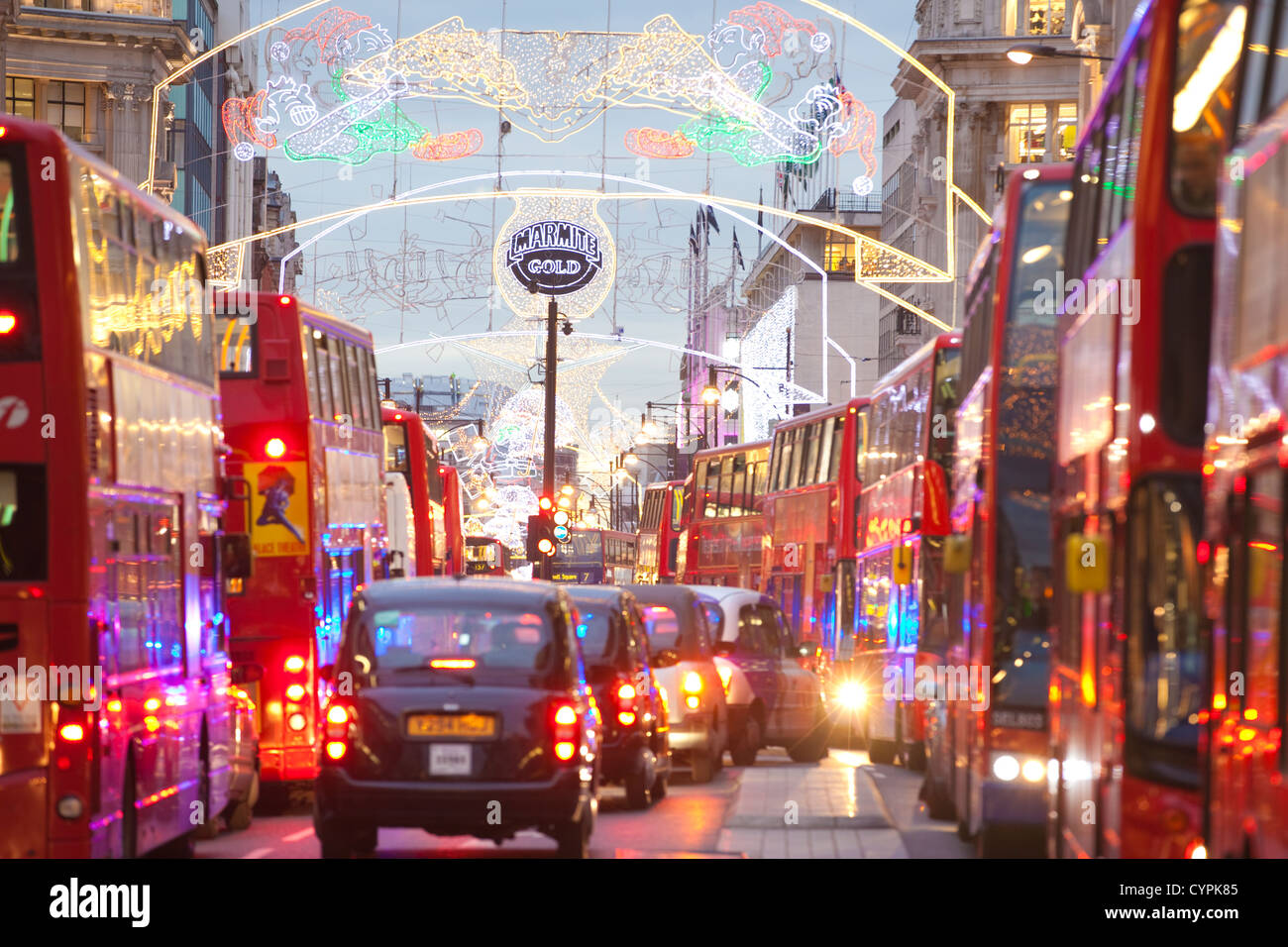 Christmas lights during rush hour at dusk on busy Oxford Street, Oxford