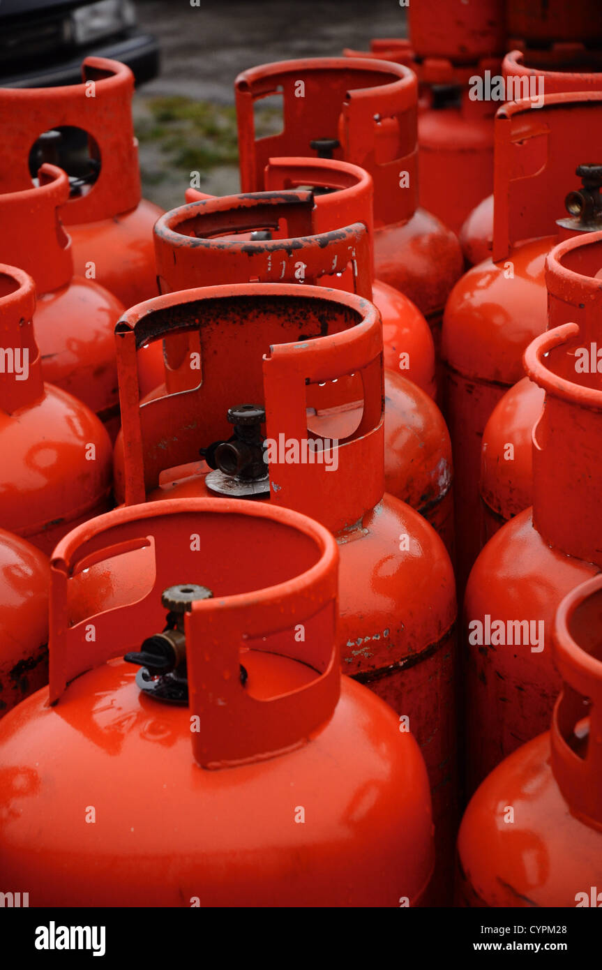 Rows of bright red gas containers or bottles Stock Photo